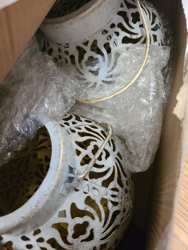 Photo 1 of 2 Pack Outdoor Solar Hanging Lantern Lights Metal LED Decorative Lamp for Garden Patio Courtyard Lawn and Table with Hollowed-Out Design (White)