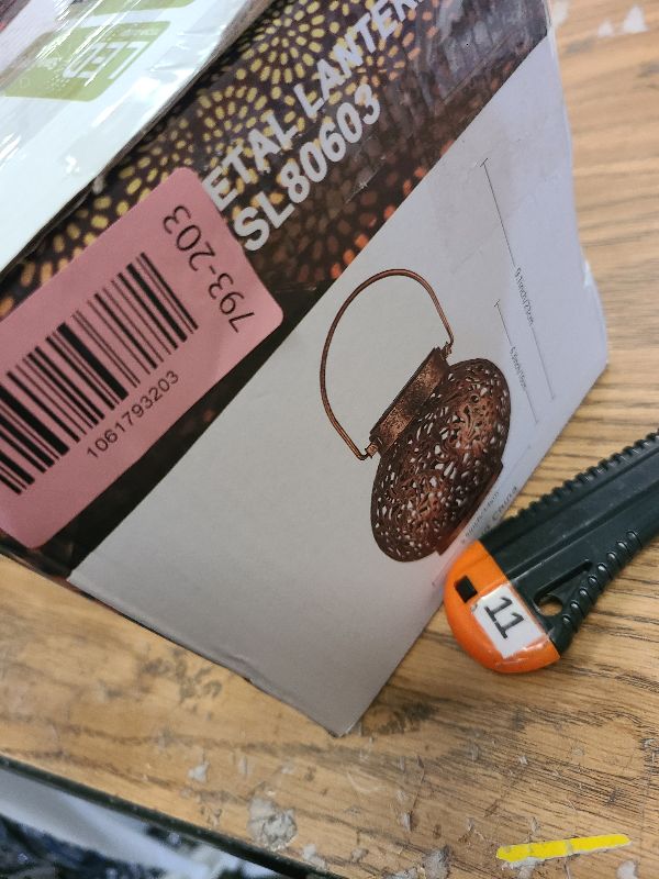 Photo 1 of 2 Pack Outdoor Solar Hanging Lantern Lights Metal LED Decorative Lamp for Garden Patio Courtyard Lawn and Table with Hollowed-Out Design (White)