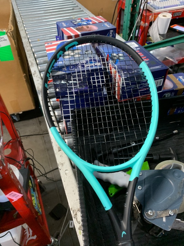 Photo 1 of (handle grip loose)
***STOCK PHOTO FOR REFERENCE ONLY***
tennis racket extreme lite