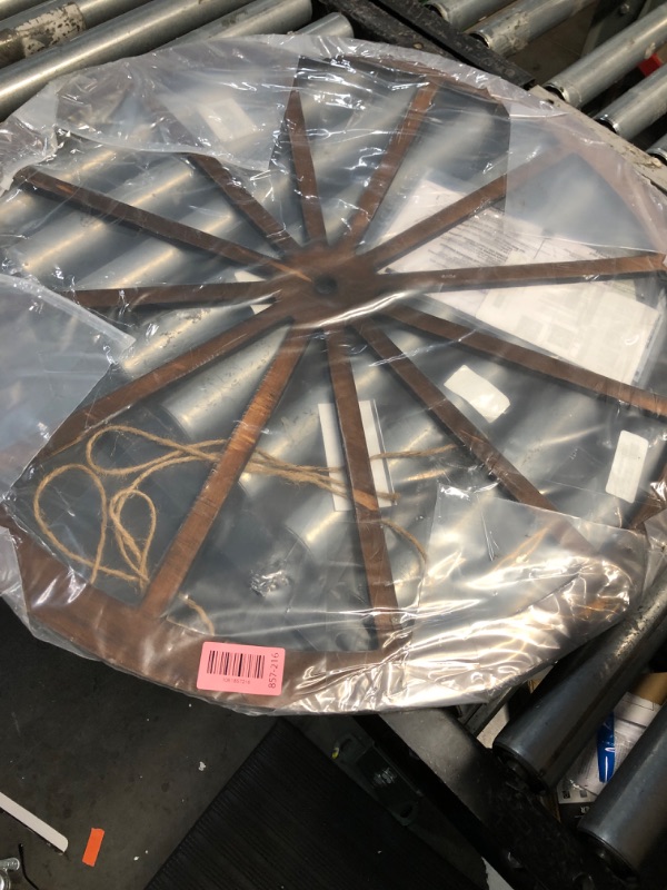 Photo 1 of ***(USED)***DaisyInner Wood Wagon Wheel Decorative Old Western Style Wagon Wheel Decor Vintage Rustic Wall Hanging Wood Cartwheel Decor for Garden Bar Patio Garage Farmhouse(30 Inch,Brown) 30 inches x 30 inches