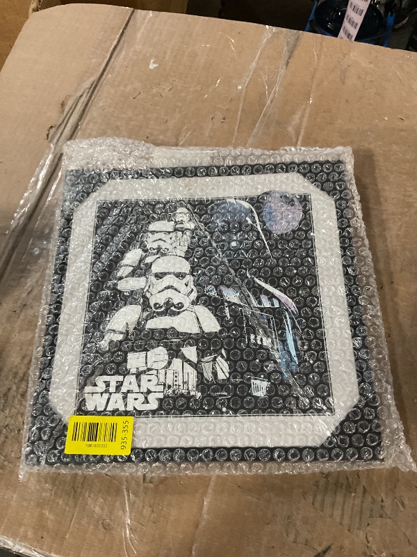 View 2 of * the back  has a rip in it *
Silver Buffalo Star Wars 12" x 12" Framed Floating Canvas Wall Sign Art – Featuring Darth Vader Storm Troopers Death Star with light grey boarder