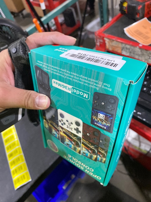 Photo 1 of R36MAX Handheld Game Console, Retro Gaming Console with 4000mAh Battery 4.0”IPS Screen, Open Source Linux System, with 64GB TF Card Portable Video Gaming Console, Transparent Ruby