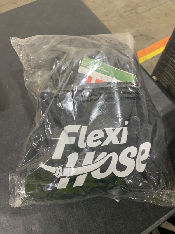 Photo 1 of Flexi Hose PLUS with 8 Function Nozzle Expandable Garden Hose, Lightweight & No-Kink Flexible Garden Hose, 3/4 inch Solid Brass Fittings and Double Latex Core, 75 ft Black