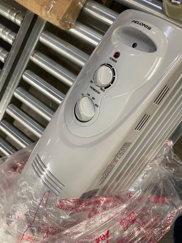 Photo 1 of ***DAMAGE POWER CORD*** PELONIS Radiator Heater for Large Space, Electric Oil Filled Radiator, Dual Knobs, 1500W, Quiet Space Heater, 3 Modes, Tip-over Protection