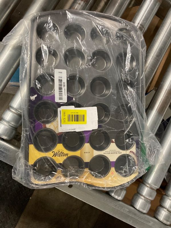 Photo 1 of **PAN IS BENT ON ONE SIDE**Wilton Gold Non-Stick 24-cup Muffin Pan, Stainless Steel Bakeware, Made without PFAs, 16 x 10 x 1 in., Packaging may Vary
