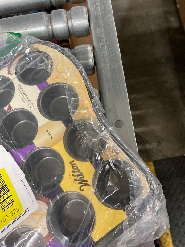Photo 1 of **PAN IS BENT ON ONE SIDE**Wilton Gold Non-Stick 24-cup Muffin Pan, Stainless Steel Bakeware, Made without PFAs, 16 x 10 x 1 in., Packaging may Vary