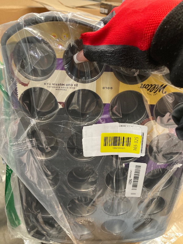 Photo 1 of **PAN IS BENT ON ONE SIDE**Wilton Gold Non-Stick 24-cup Muffin Pan, Stainless Steel Bakeware, Made without PFAs, 16 x 10 x 1 in., Packaging may Vary