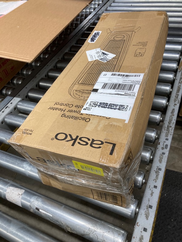 Photo 1 of **broken**Lasko 1500W Ceramic Tower Space Heater with Remote, Thermostat, Timer & Widespread Oscillation, Portable Electric Heater for Indoor Use, Bedroom & Living Room, 751320