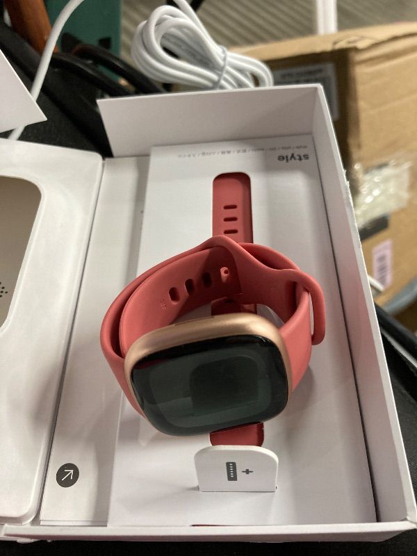 Photo 1 of **MISSING CHARGER**Fitbit Versa 4 Fitness Smartwatch with Daily Readiness, GPS, 24/7 Heart Rate, 40+ Exercise Modes, Sleep Tracking and more, Pink Sand/Copper Rose, One Size (S & L Bands Included)