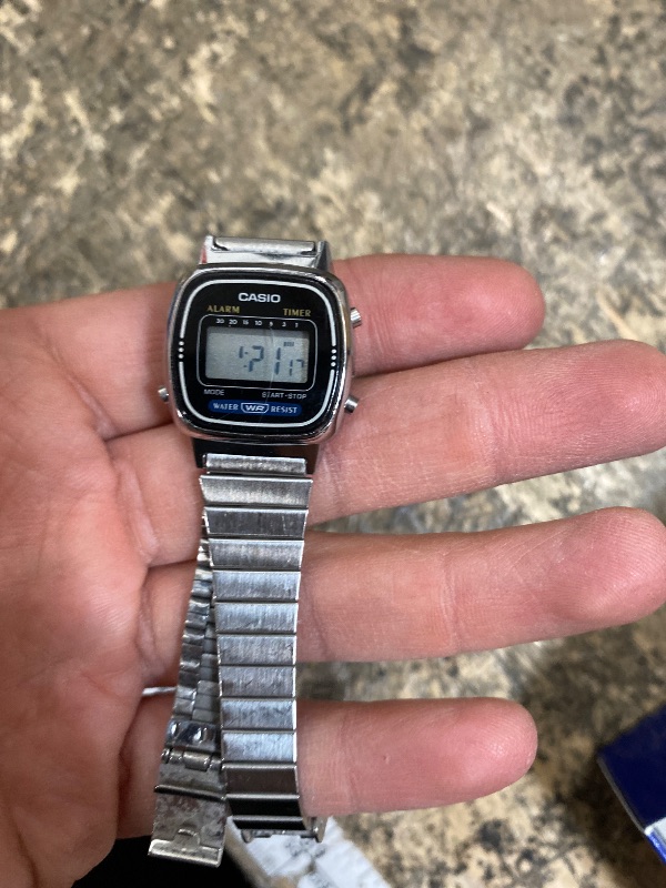 Photo 1 of **CRACKED WATCH FACE** Casio LA-670WA-1 | Unisex Digital Watch | Silver | WR | 1/10 SEC Stopwatch | Countdown Timer | Daily Alarm | LED Display | Auto Calendar | Regular Timekeeping (HR, Min, SEC, PM, Date, Day) | 2 Year Battery