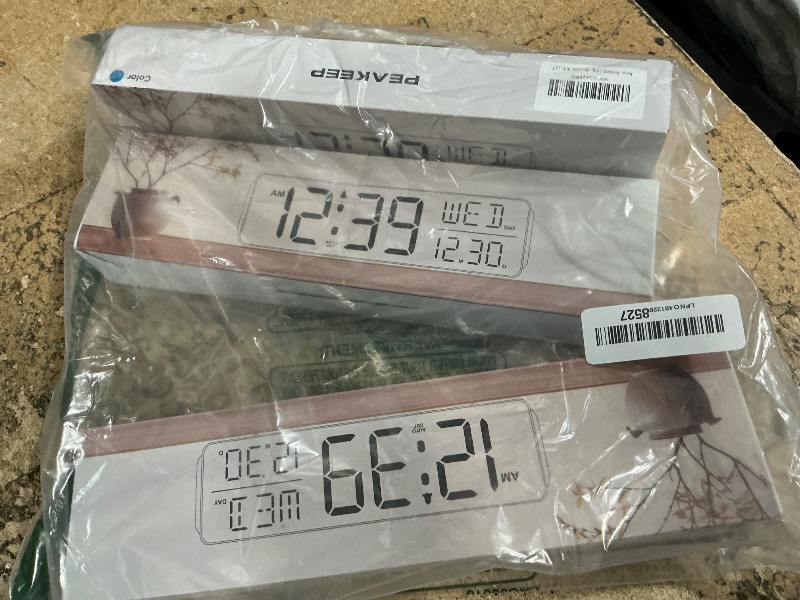 Photo 1 of  (3) Peakeep Large Display Digital Alarm Clock for Bedrooms, Date Day of Week Calendar Desk Table Clocks for Living Room Office, Dimmable Plug in Electric Clock, 5 Volumes, Loud, Auto DST