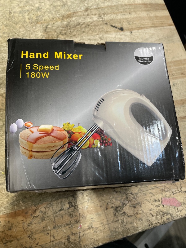 Photo 1 of  5 speed hand mixer white 