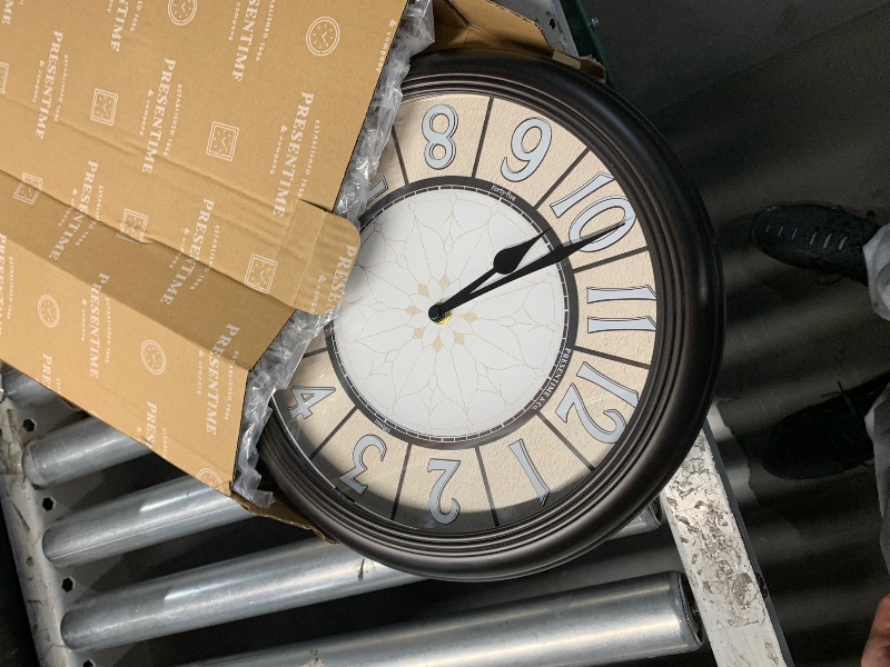 Photo 1 of ***STOCK PHOTO FOR REFERENCE ONLY***Tahitica 16 Inch Wall Clock, Round with 3D Numerals, Large Clock Wall Decor, Battery Operated, Modern Decor for Home, Office, and Living Room