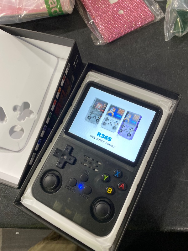 Photo 1 of R36S Retro Game Console, Handheld Game Console with 3.5-in IPS HD Screen?Video Game Consoles with 64GB Memory, Ultra-Long Standby Time, Perfect for Travel & Outings, Gift for Adults Teens Kids (Black)