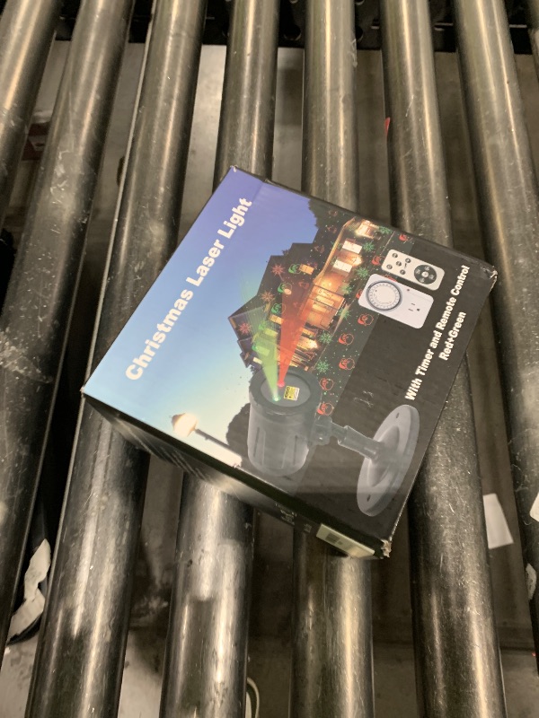 Photo 1 of  Christmas Projector Laser Lights Outdoor - Outlet Timer and Remote Included - 18 Patterns - Red and Green 