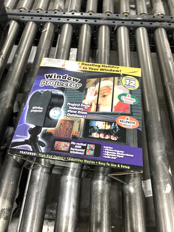 Photo 1 of  Christmas Windows Projector, Halloween Projector with a Tripod, Christmas Projector Built-in 12 Movies Mini Outdoor Halloween Projectors for XMS,Halloween Outdoor Decorations 