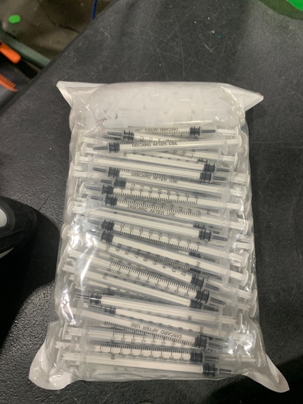 Photo 1 of 100 Pack 1ml Syringe with Cap for Liquid, 1cc Plastic Small Syringes with Cover, Non-Sterile, No Needle