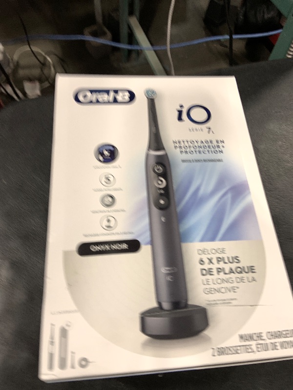 Photo 1 of Oral-B iO Deep Clean + Protect Rechargeable Electric Toothbrush, Black with a iO Series 7 Toothbrush, 2 Replacement Brush Heads, and a Charging Travel Case