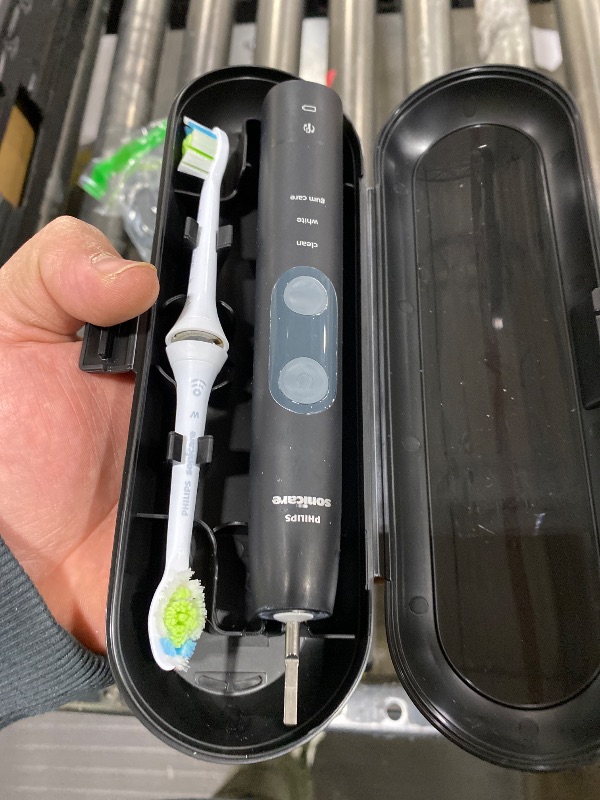 Photo 1 of Philips Sonicare ProtectiveClean 5300 Rechargeable Electric Toothbrush, with Pressure Sensor, 3 Cleaning Modes, SmarTimer and QuadPacer, with 2 Bonus Brush Heads, Travel Case, Black, Model HX6423/34
