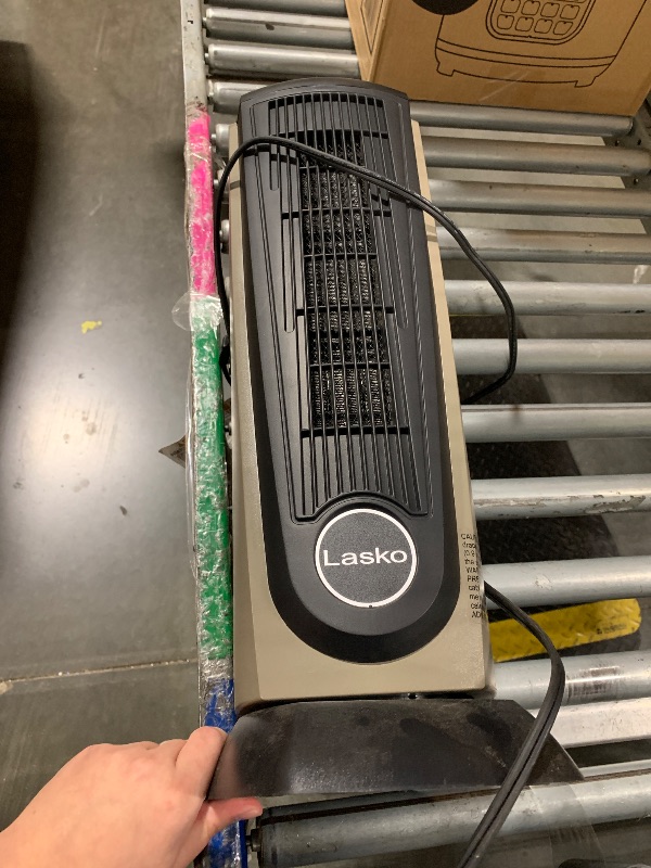 Photo 1 of ****SIMILAR ITEM**** Lasko Portable Electric 1500 Watt Room Oscillating Ceramic Tower Space Heater with Remote, Adjustable Thermostat, Digital Controls, and Timer, Black