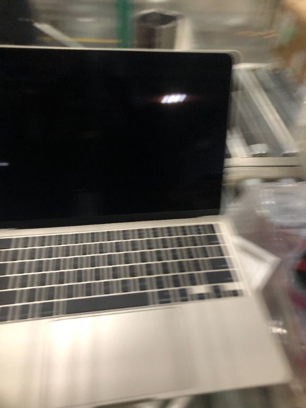Photo 1 of ***It turns on and off, but it's missing an accessory.***Apple 2025 MacBook Air 13-inch Laptop with M4 chip: Built for Apple Intelligence, 13.6-inch Liquid Retina Display, 16GB Unified Memory, 256GB SSD Storage, 12MP Center Stage Camera, Touch ID; Starlig