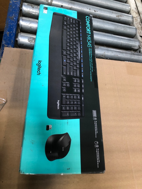 Photo 1 of ***The right lever at the back for lifting the keyboard is broken. THE DEVICE ITSELF WORKS VERY WELL**** Logitech MK345 Wireless Keyboard and Mouse Combo with Palm Rest, 2.4 GHz USB Receiver, Compatible with PC, Laptop, Black