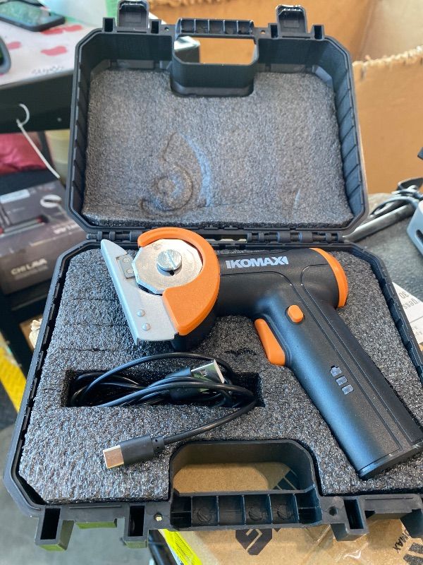 Photo 1 of **NON-FUNCTIONAL**
KOMAX Cordless Electric Scissors,4V Cardboard Cutter with 3 Blades,Rechargeable 2000mAh Battery,Storage Box,Fabric Scissors Electric Box Cutter for Cardboard,Leather,Carpet,Fabric,Plastic - Black