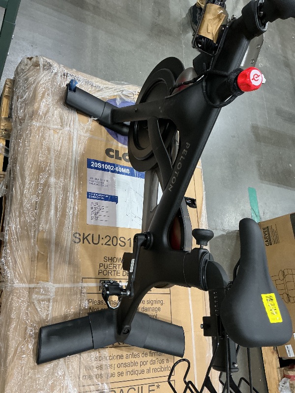 Photo 1 of *NON-FUNCTIONAL*
Peloton Exercise Cross Training Bike, Indoor Stationary Spin Bike for Home Workouts, Space-Friendly Exercise Equipment for Cardio and strength Workout & Indoor Cycling
