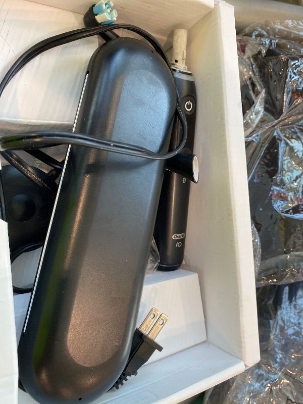 Photo 1 of **UNTESTED**
Oral-B Rechargeable Electric Toothbrush, iO10 Ultimate Clean, 7 Cleaning Modes, Interactive Display, iSense Charger, Charging Travel Case, 4 Brush Heads, Rechargeable Toothbrush, Black