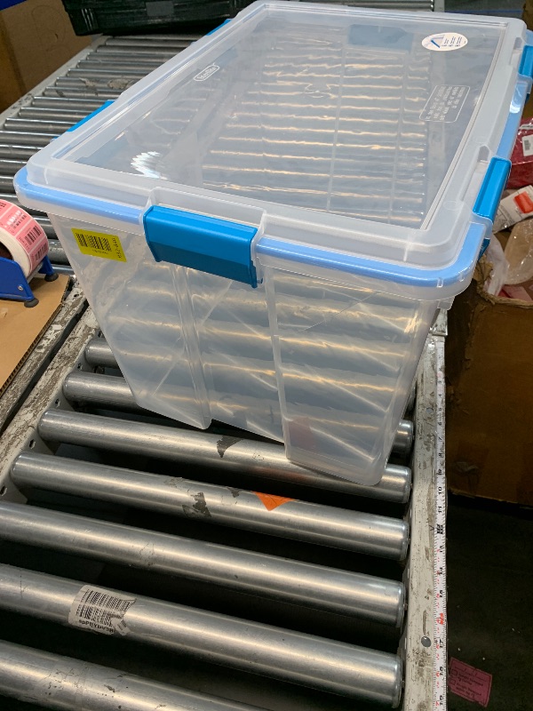 Photo 1 of ***DAMAGED*** 
Sterilite 80 Qt Gasket Box, Stackable Storage Bin with Latching Lid and Tight Seal, Plastic Container to Organize Basement, Clear Base and Lid, 1-Pack