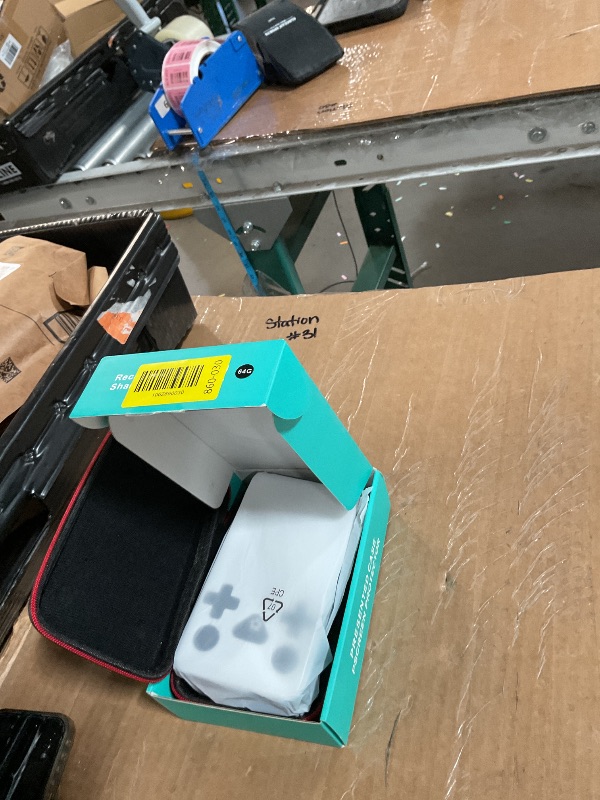 Photo 1 of ?R36MAX 4000mAh Portable Rechargeable Handheld Retro Game Console,Comfort Non-Slip Handheld Standing Retro Game Console with 64G TF Car,4.0-inch Screen,for Office,Black