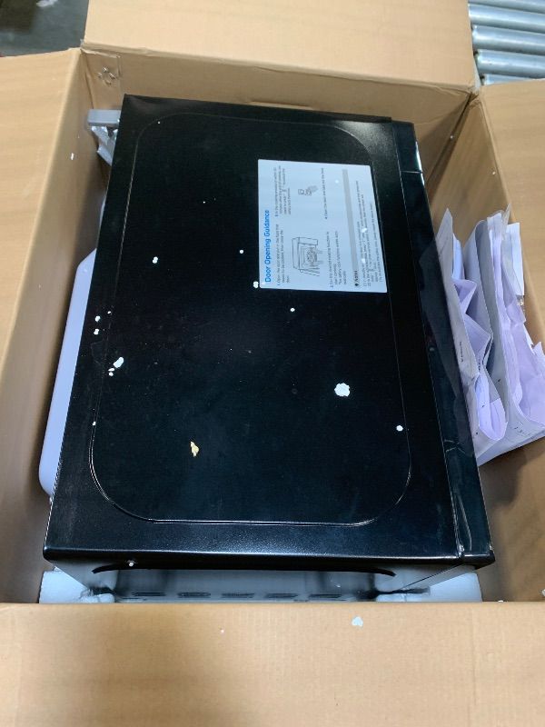 Photo 1 of **MAJOR DAMAGE**
BLACK+DECKER 0.7 Cu. Ft. 700-Watt Compact Countertop Digital Microwave Oven, LED Lighting, Child Lock, Stainless Steel