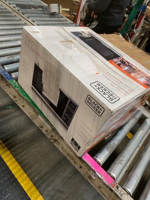 Photo 1 of **MAJOR DAMAGE**
BLACK+DECKER 0.7 Cu. Ft. 700-Watt Compact Countertop Digital Microwave Oven, LED Lighting, Child Lock, Stainless Steel