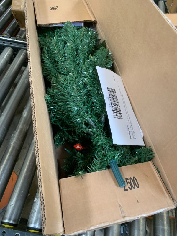 Photo 1 of Garvee 6FT Christmas Tree, Artificial Prelit Pencil Tree, Easy Assemble, Xmas Decor for Home Party Office Mall Holiday