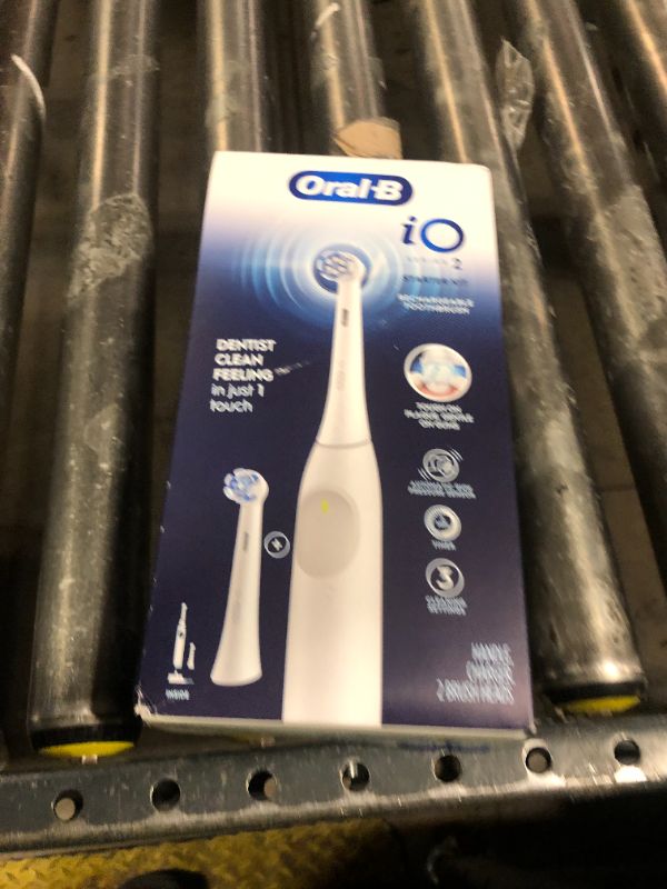 Photo 1 of Oral-B iO Series 2 Rechargeable Electric Powered Toothbrush Starter Kit, Pure White with 2 Brush Heads - Automatic Pressure Sensor to Protect Gums - 3 Modes - 2 Min Timer