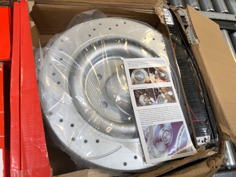 Photo 1 of a premium front and rear drilled and slotted disc brake rotors and ceramic pads for select jaguar models 
