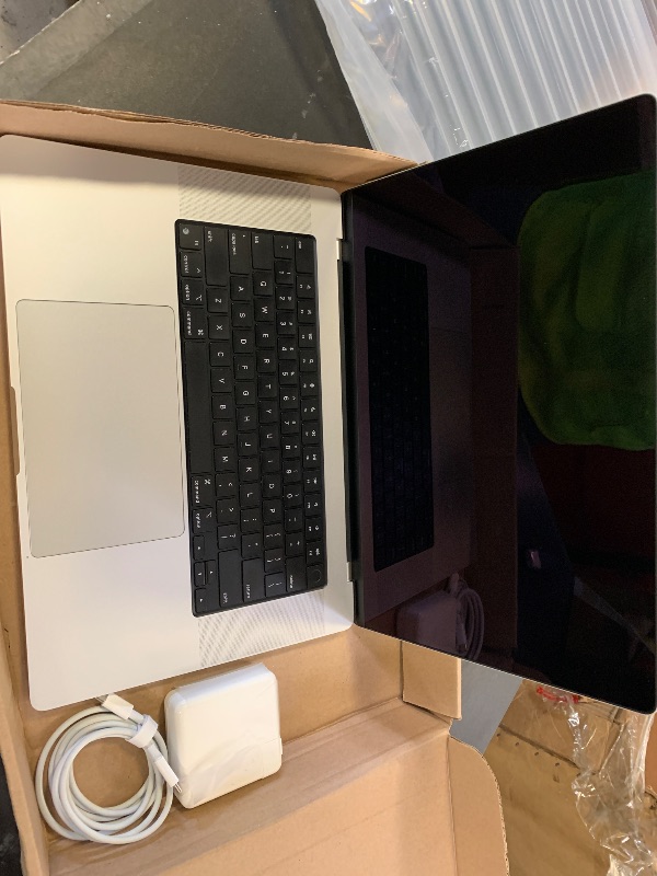 Photo 1 of Apple MacBook Pro Late 2021 with Apple M1 Pro chip (16-inch, 16GB RAM, 512GB SSD) Space Gray (Renewed)