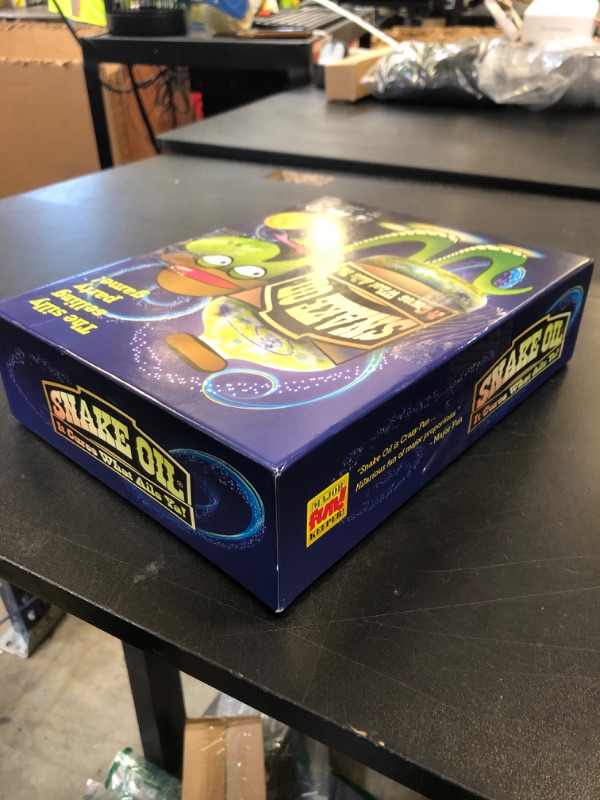 Photo 1 of SNAKE OIL - The Silly Selling Party Game - Funny Group 3-10 Player Card Games - Fun Travel Activity for Friends and Family - Core Game for Ages 10+