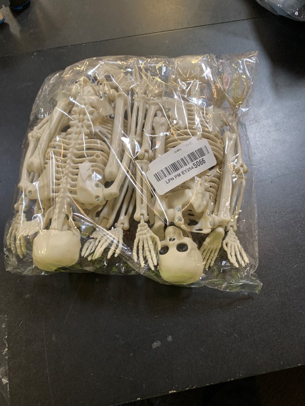 Photo 1 of 4 Packs Posable Halloween Skeleton, Full Body Skeleton Decoration Movable Posable Joints Skeletons, Scary Plastic Skeleton Halloween Skull Decor for Yard Garden Lawn Haunted House Graveyard Props
