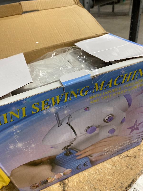 Photo 1 of ***UNTESTED/ POSSIBLY FOR PARTS*** Portable Sewing Machine with Extension Table and Light, Mini Handheld Sewing Machine with Upgraded, Two Threads Double Speed Double Switches, Easy to Use for Kids, Beginners and DIY