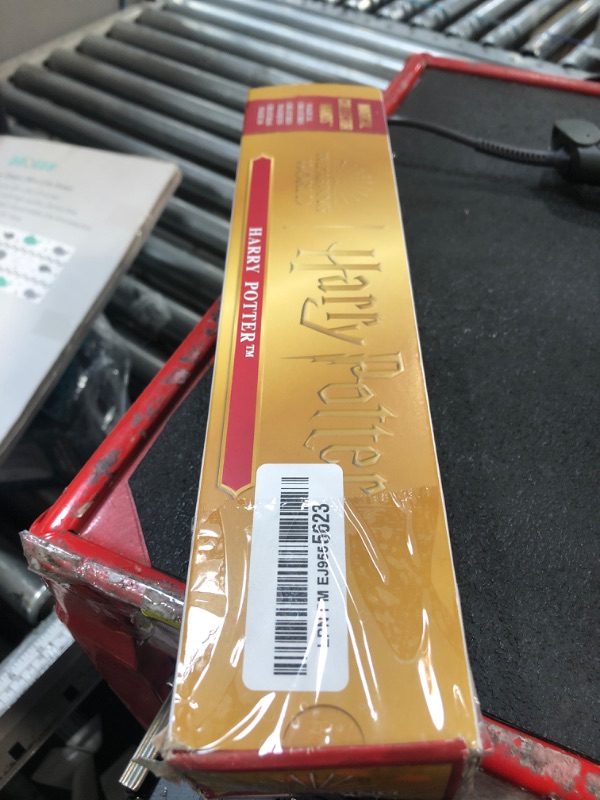 Photo 1 of Wizarding World Harry Potter, 12-inch Magical Collector Harry Potter Wand with Stand & Die-cast Icon, Magical Creatures, Fun Gifts & Stocking Stuffers