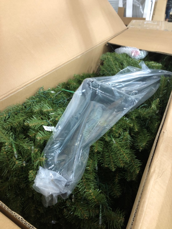 Photo 1 of National Tree Company 9 ft Pre-Lit Dunhill Fir Artificial Christmas Tree, 900 LED Lights, 4,026 Tips, Foot Pedal, 10 Light Functions, Includes Stand, Green