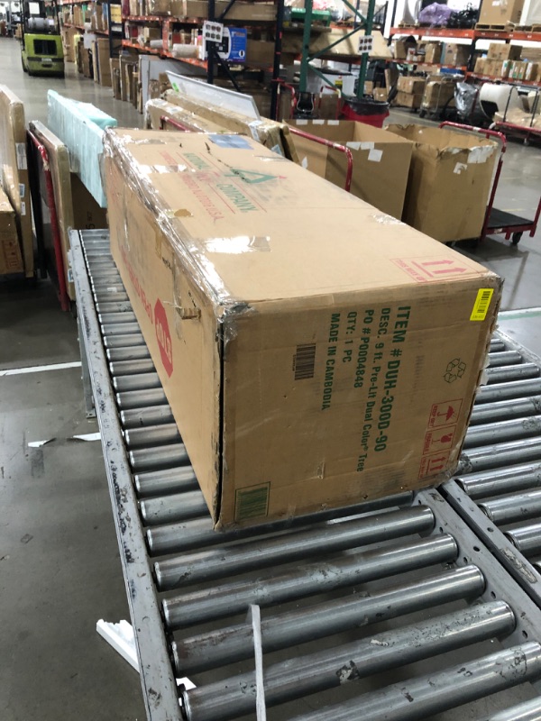 Photo 1 of National Tree Company 9 ft Pre-Lit Dunhill Fir Artificial Christmas Tree, 900 LED Lights, 4,026 Tips, Foot Pedal, 10 Light Functions, Includes Stand, Green