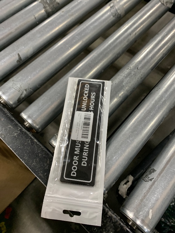 Photo 1 of (2 PACK) This Door To Remain Unlocked During Business Hours Sign, Self-adhesive Waterproof Aluminum Metal Signs for Indoor Outdoor Use (7x2 inch, Black)