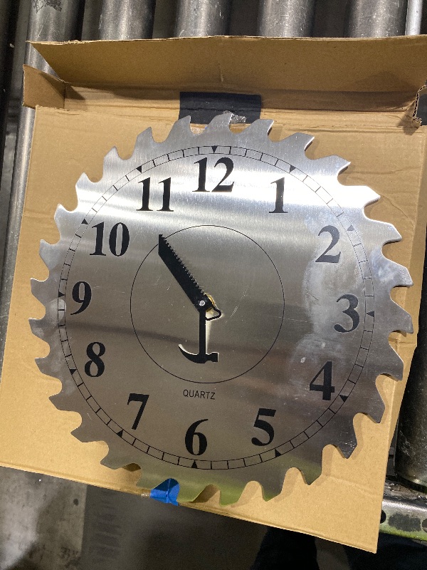Photo 1 of 12 Inch Metal Wall Clock with Circular Saw Blade Dial, Handsaw and Hammer Pointer