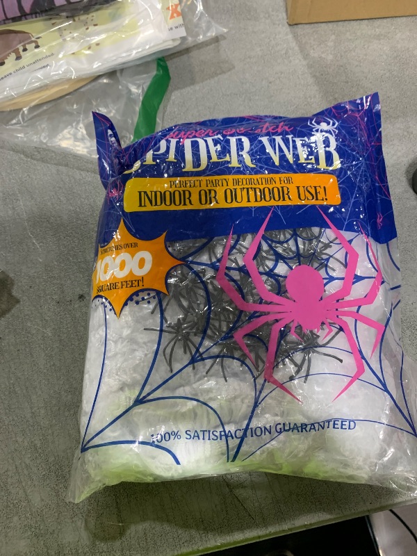 Photo 1 of 1000 sqft Spider Webs Halloween Decorations Bonus with 30 Fake Spiders, Super Stretch Cobwebs for Halloween Indoor and Outdoor Party Supplies
