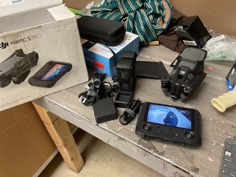 Photo 1 of **LOCKED, NONFUNCTIONAL** INCOMPLETE* DJI Mavic 3 Pro Fly More Combo with DJI RC Pro (High-Bright Screen), 4/3 CMOS Hasselblad, 3 Intelligent Flight Batteries, Charging Hub, FAA Remote ID Compliant, 4K Camera Drone for Adults, Black