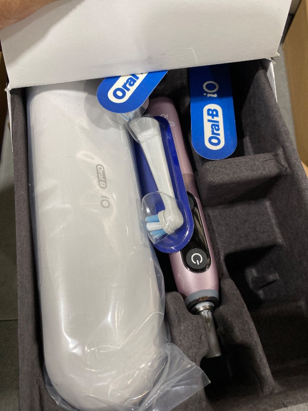 Photo 1 of Oral-B iO Series 9 Limited Rechargeable Rose Quartz Electric Toothbrush with (2) Ultimate Clean and (1) Gentle Care Replacement Brush Heads, White, Travel Case-White and Charger