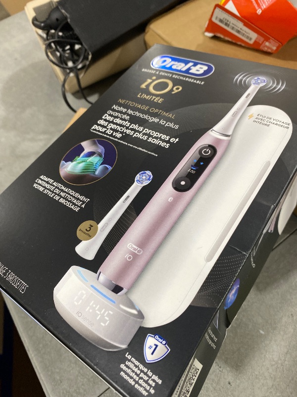 Photo 1 of Oral-B iO Series 9 Limited Rechargeable Rose Quartz Electric Toothbrush with (2) Ultimate Clean and (1) Gentle Care Replacement Brush Heads, White, Travel Case-White and Charger