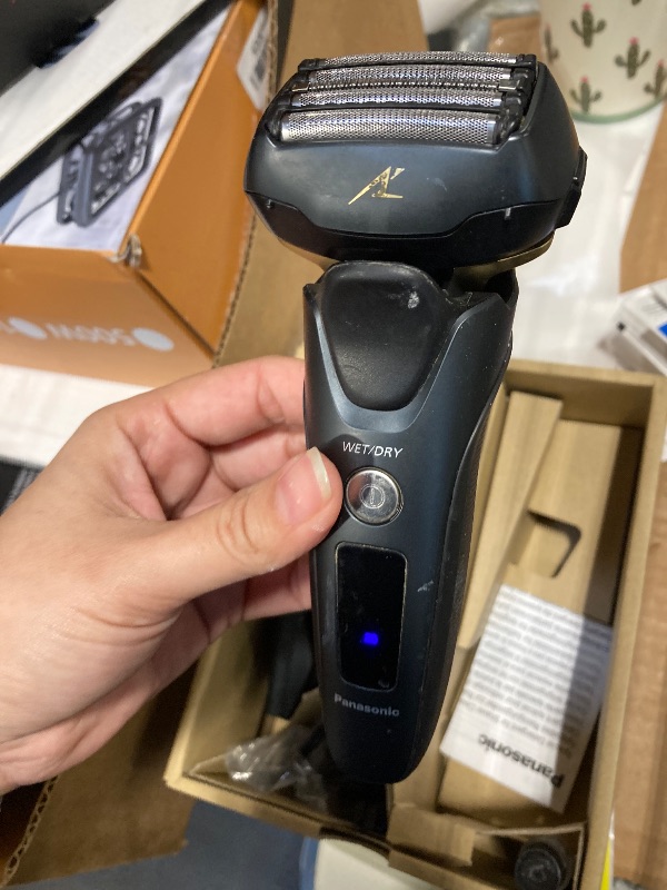 Photo 1 of ***It looks used.*** Panasonic Electric Razor for Men, Electric Shaver for Men, ARC5 with Premium Automatic Cleaning and Charging Station, Wet Dry Shaver, Cordless Razor, with Pop-Up Trimmer ES-LV97-K, Black
